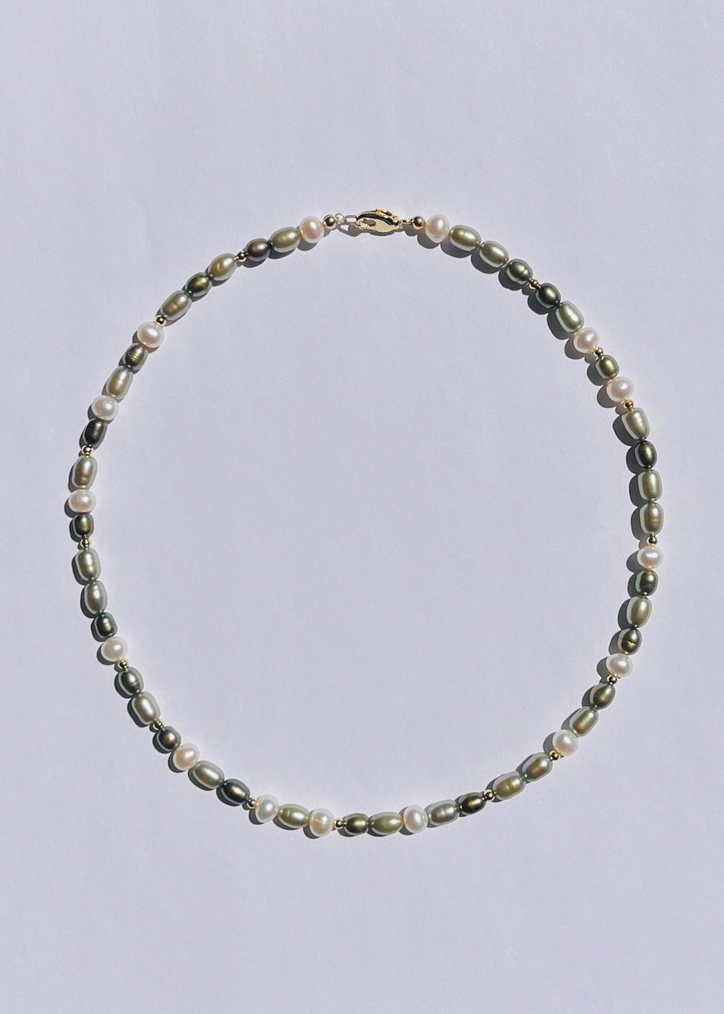 Clove green freshwater pearl necklace with earthy layered tones and gold accents