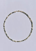 Clove green freshwater pearl necklace with earthy layered tones and gold accents