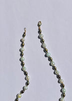 Detail of sea foam blue and pine green pearls and gold-filled accents on the Nami necklace