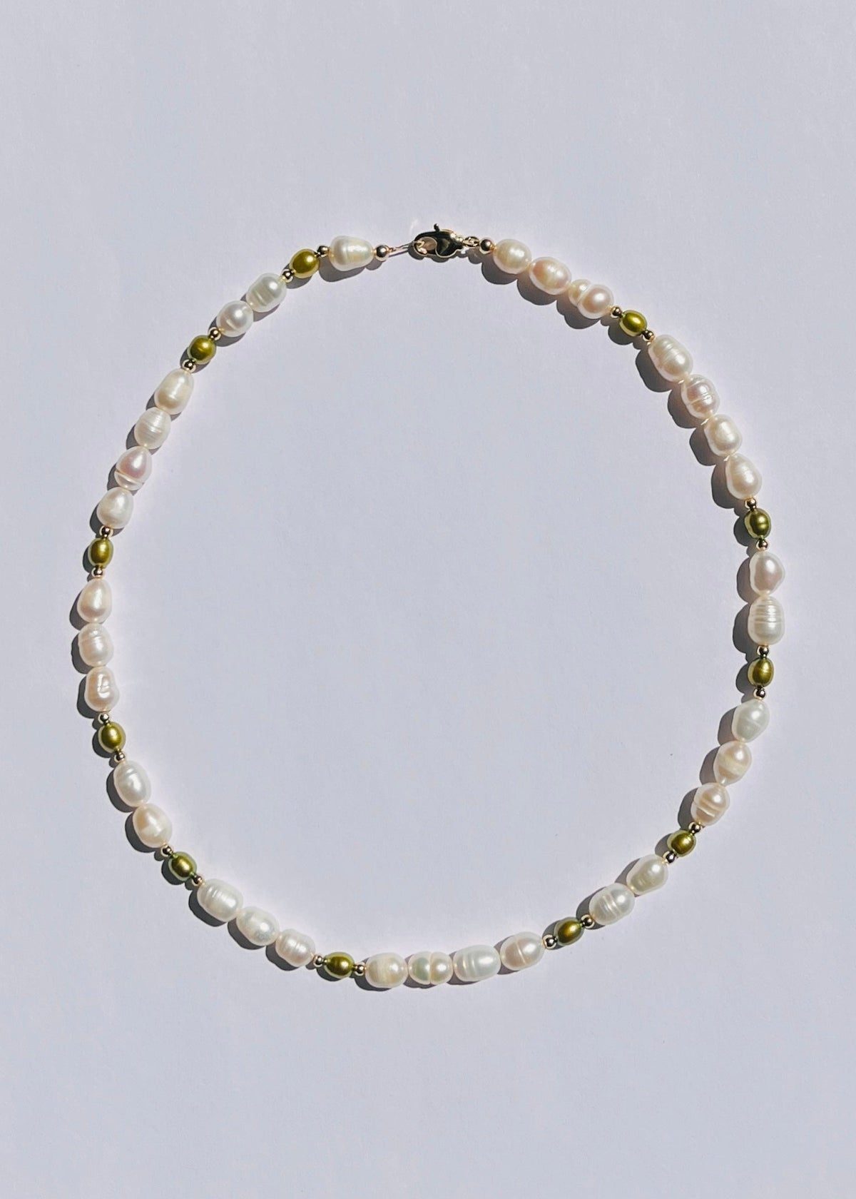 Classic white pearl necklace with olive green freshwater pearls with gold filled accents