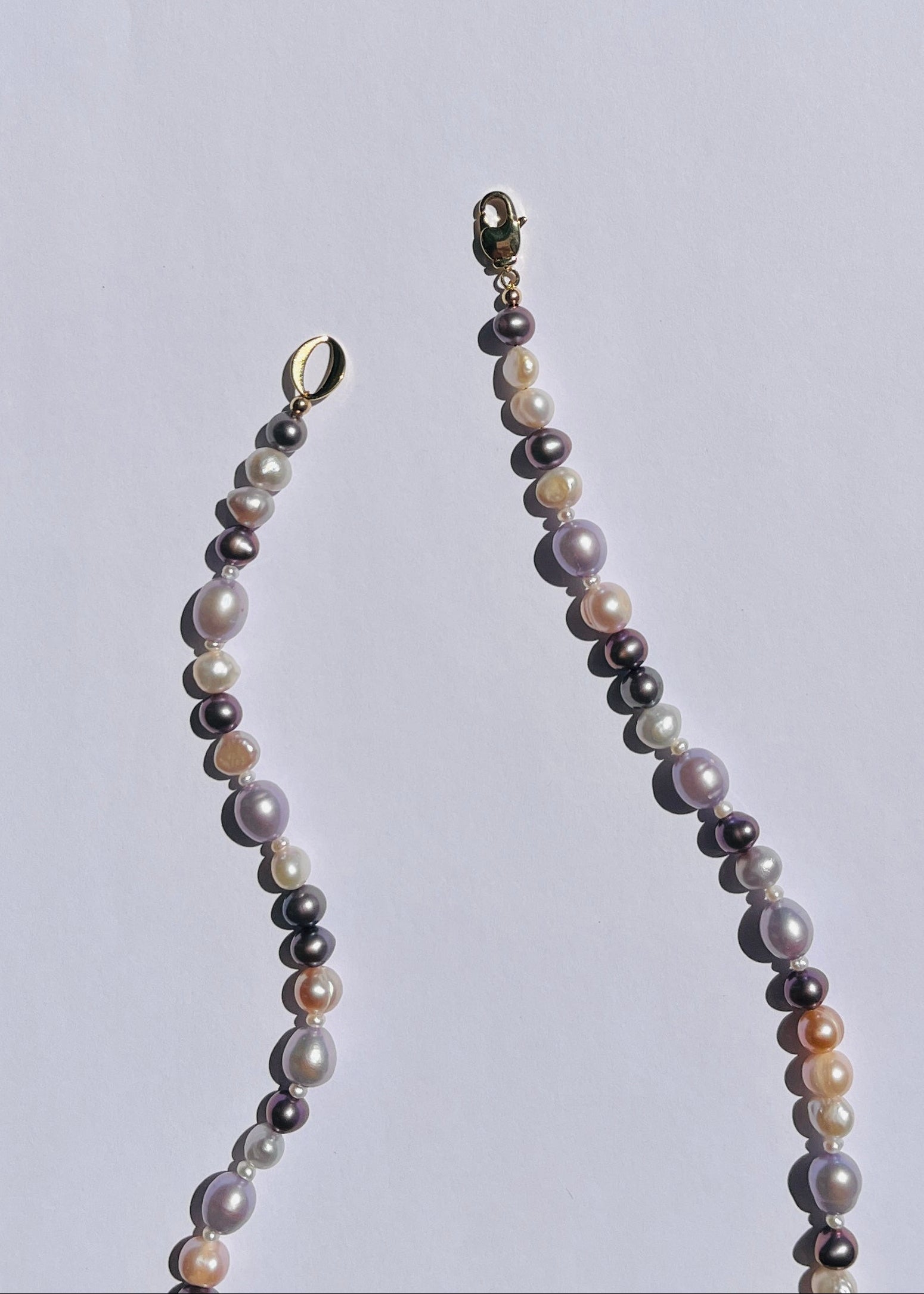 Detail of purple, lavender and mauve pearls and gold-filled accents on the Umeko necklace
